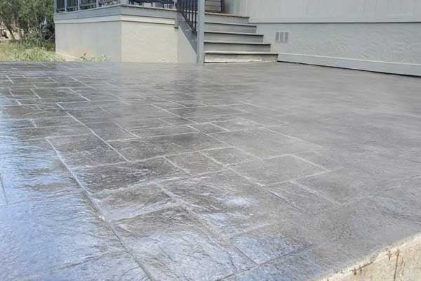 Outdoor stamped concrete with light grey color texture